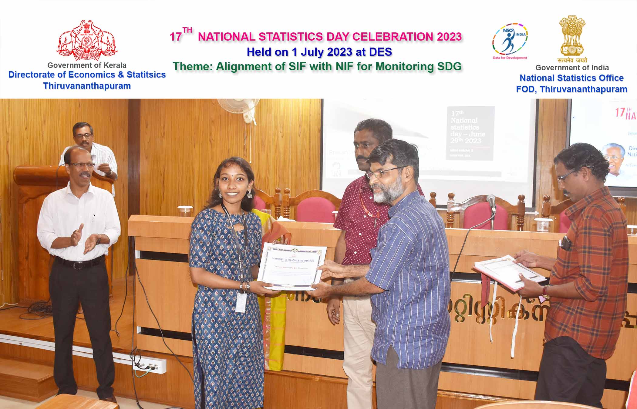 Smt. Reshma T SStat Assistant Grade II receiving certificate for the first prize in Quiz Competition