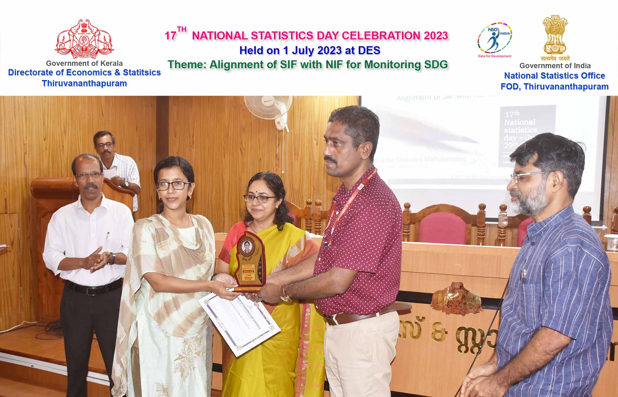 Smt. Neethymol Kurian Stat Assistant Grade II receiving memento and certificate for the third prize in Quiz Competition