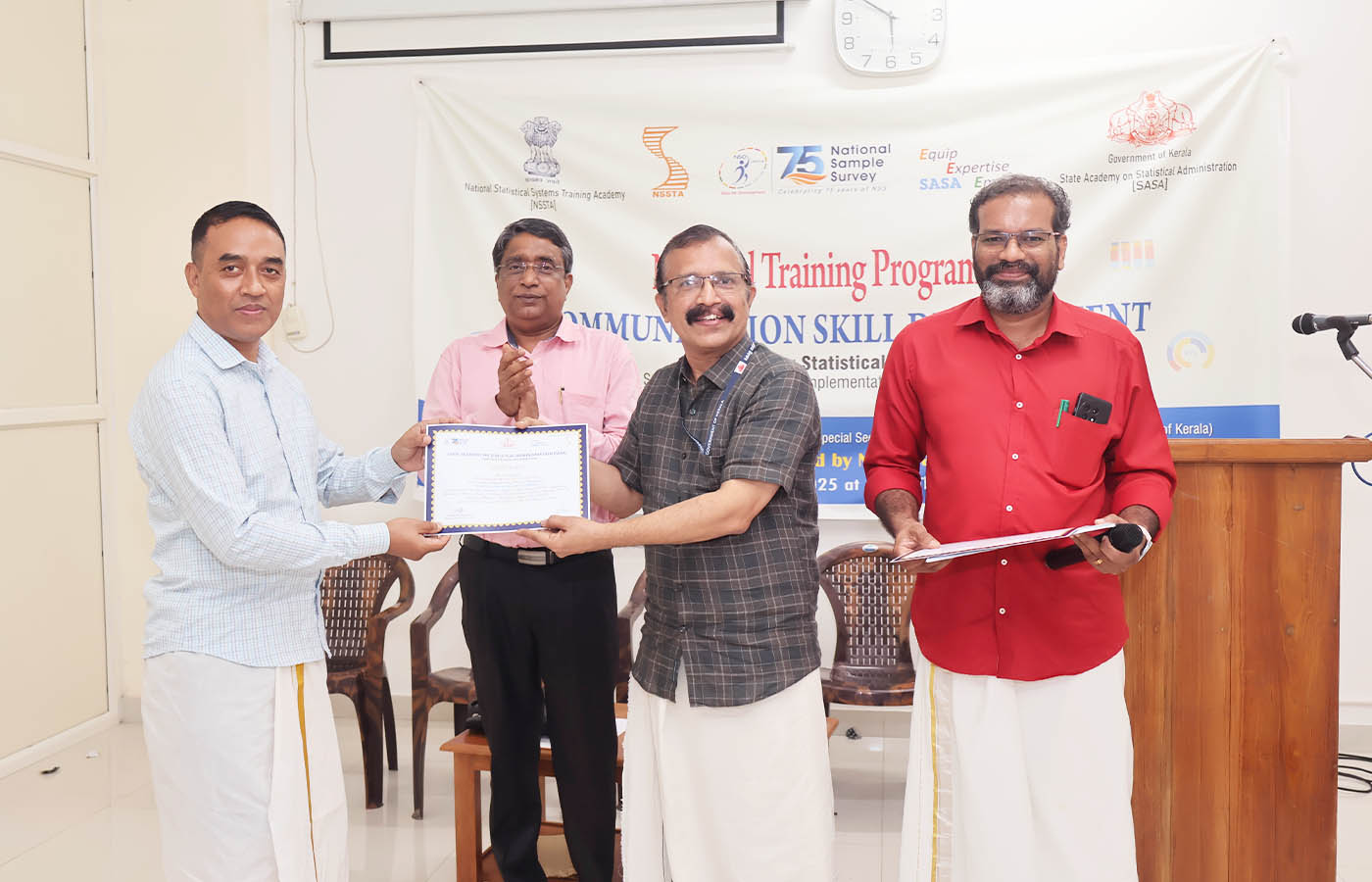 Presenting certificate to Sri. P Hoojon, Senior Statistical Officer, NSO (FOD) Guwahati, Assam